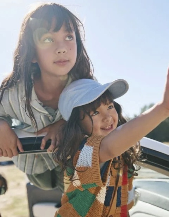 Two children enjoying a bright day outdoors